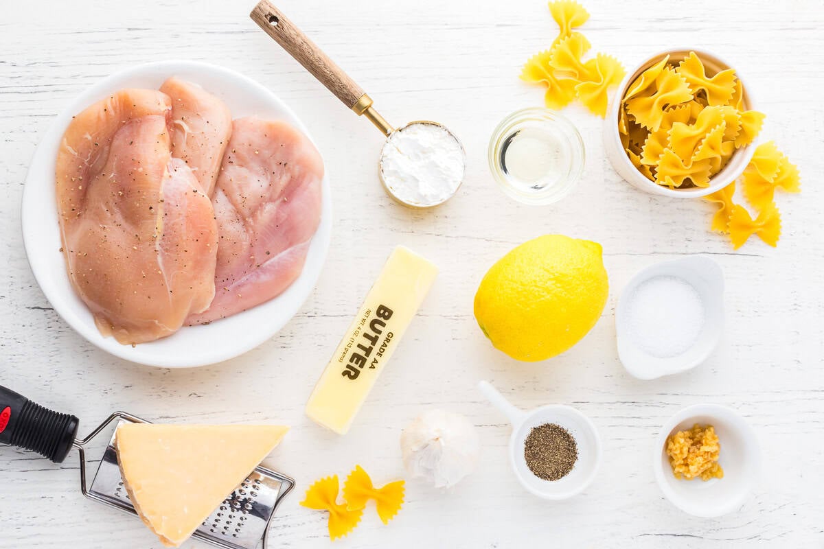 portioned ingredients for lemon chicken pasta in individual containers.