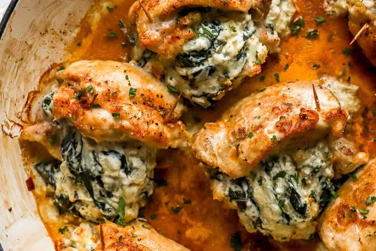 stuffed chicken thighs in a skillet.
