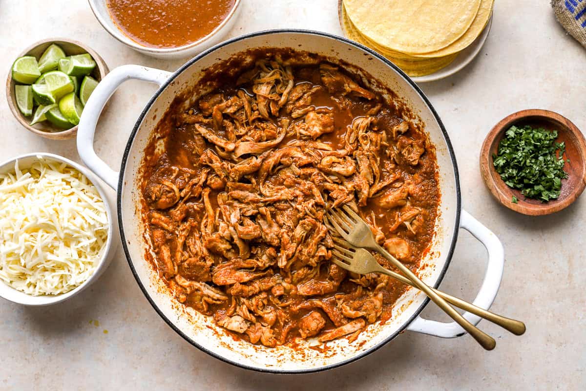 shredded saucy chicken birria in a pan.