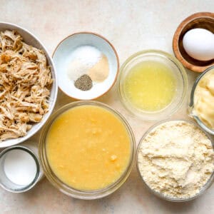 portioned ingredients for chicken cornbread casserole in individual containers.