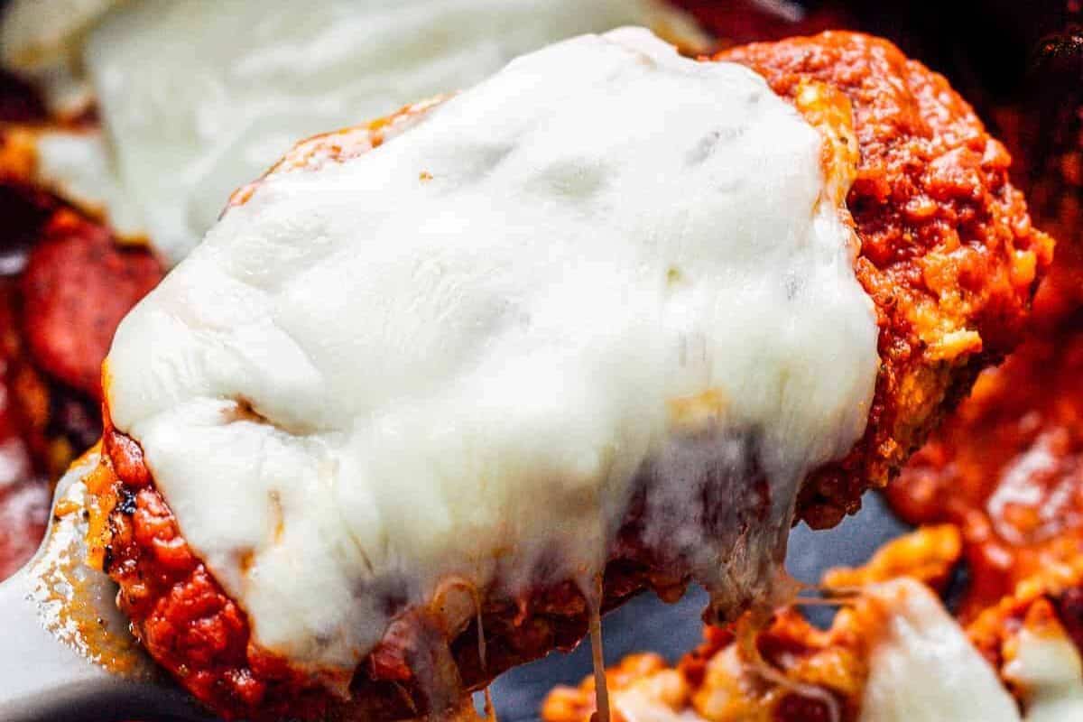 lifting up chicken parmesan in crockpot