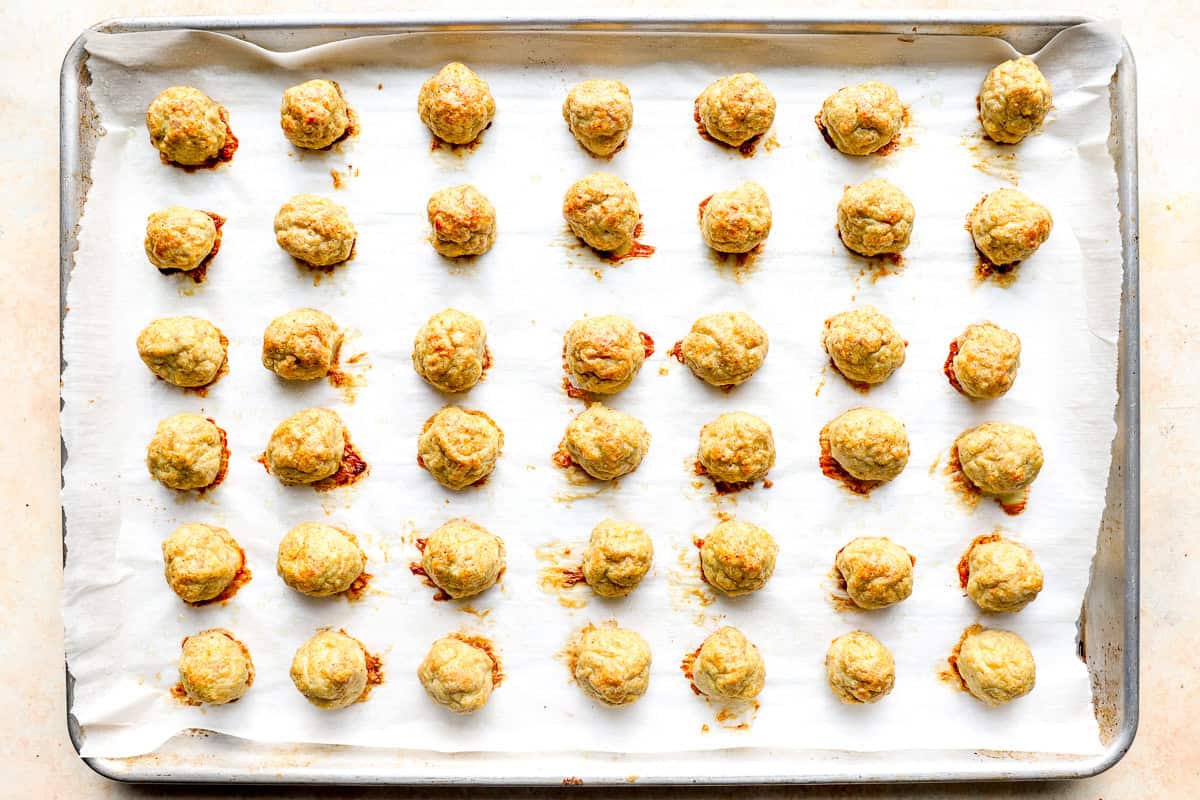 baked chicken meatballs on a baking sheet.