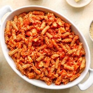 chicken parmesan casserole filling in a casserole dish.