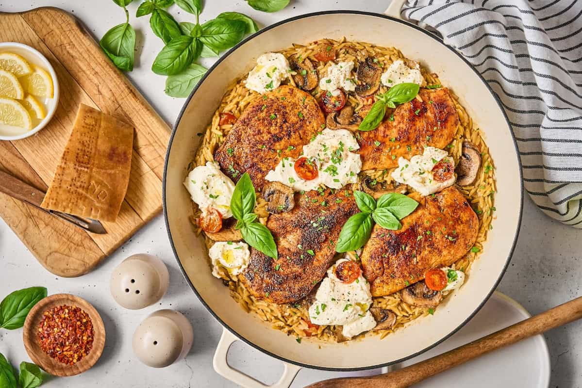 fresh basil and parsley over a ricotta chicken orzo skillet.