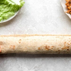 a rolled up chick fil a cool wrap.