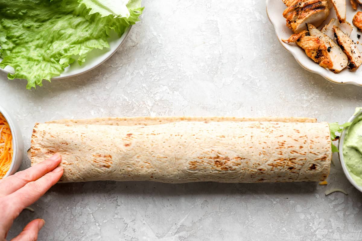 a rolled up chick fil a cool wrap.