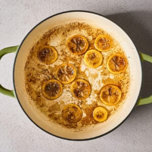 browning lemon slices in a skillet.