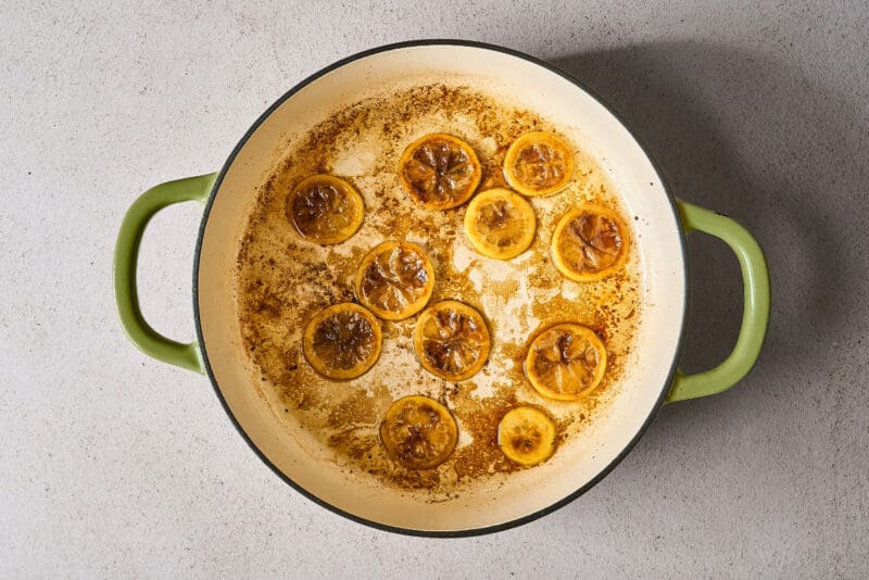 browning lemon slices in a skillet.