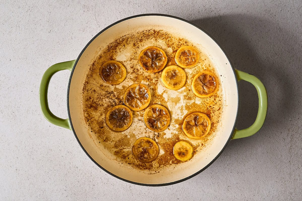 browning lemon slices in a skillet.