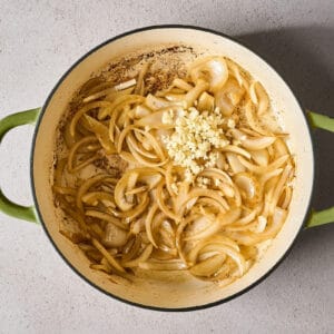 sautéing onion and garlic in a skillet.