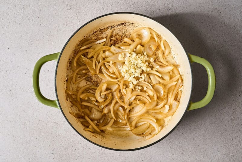 sautéing onion and garlic in a skillet.