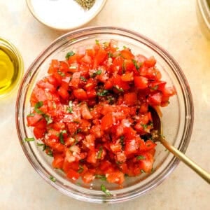 chopped bruschetta mixture in a glass bowl.