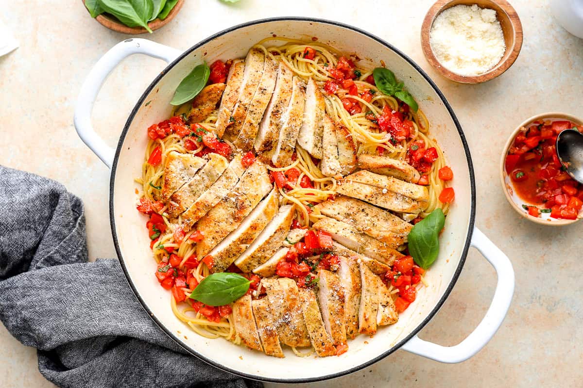 bruschetta chicken pasta in a pan.
