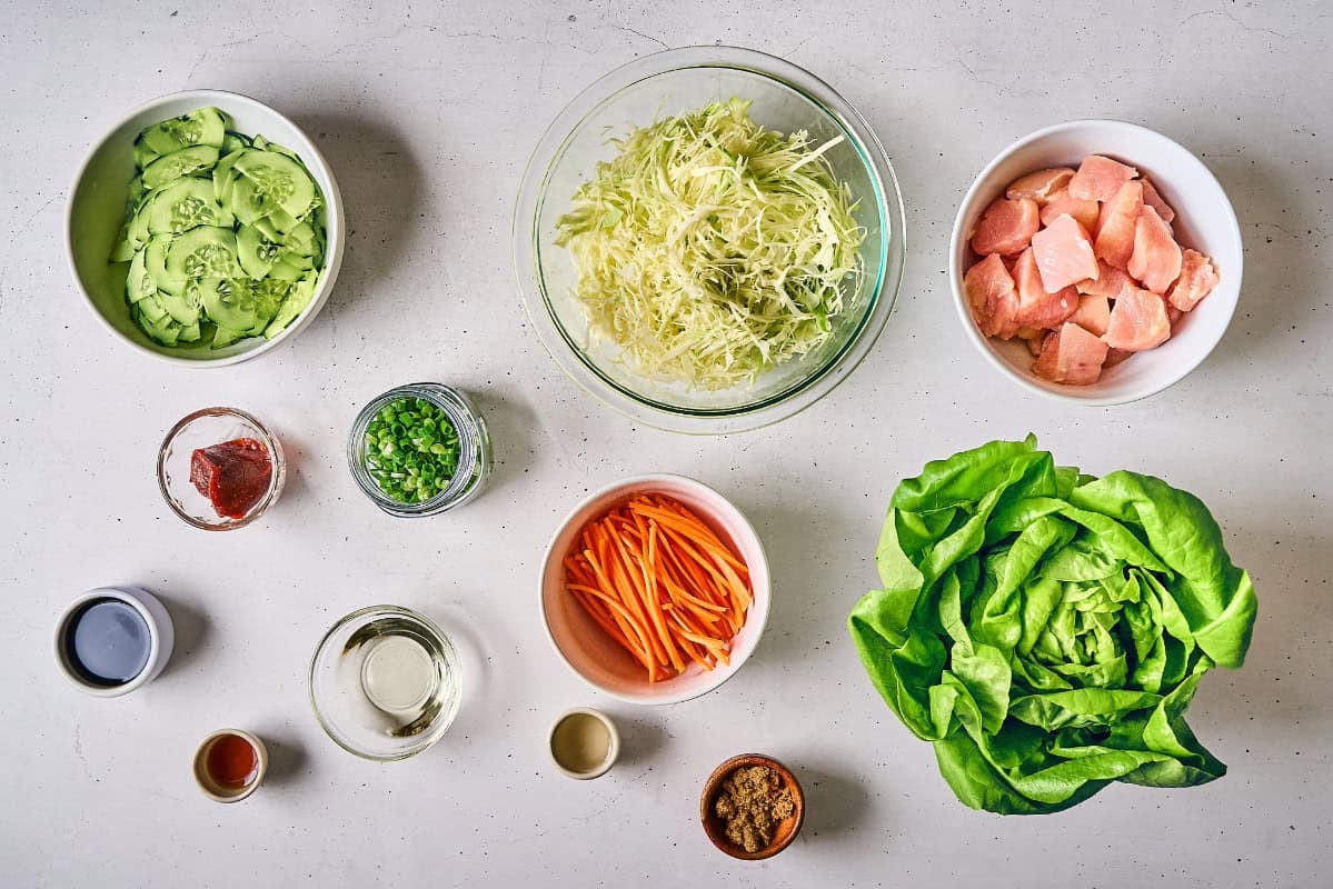 portioned and prepped ingredients for korean bbq chicken salad.