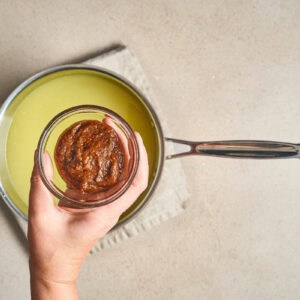 pho soup paste in a small bowl over a pot.
