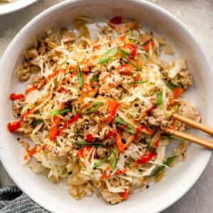 Chicken Egg Roll served in a bowl with chopsticks.