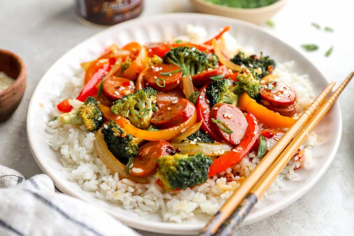 Stir fry served on a plate with rice.