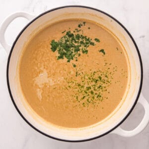 Fresh cilantro added to the thickened sauce.