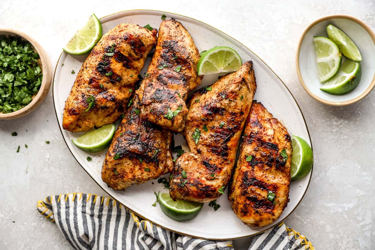 A plate of grilled chicken breasts.