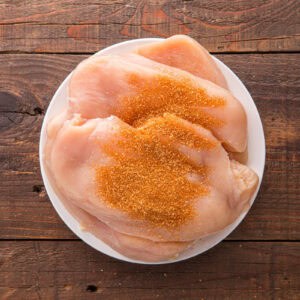 Barbeque rub on chicken breasts.