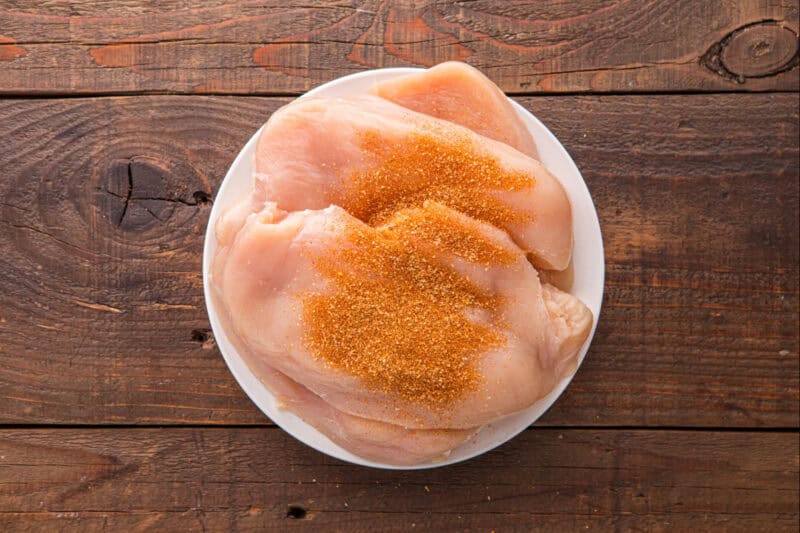 Barbeque rub on chicken breasts.