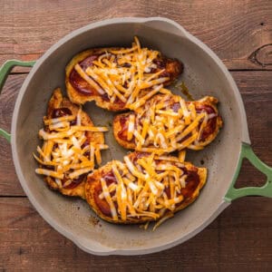 Cheese added on top of the chicken and barbecue sauce.