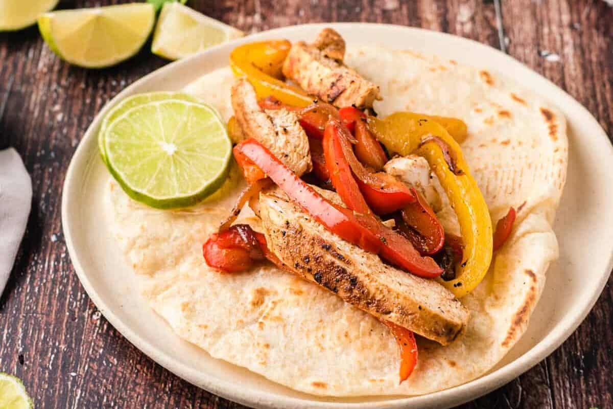 chicken fajitas with veggies in tortilla