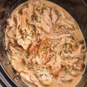 Honey mustard shredded chicken in a slow cooker.