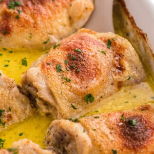 Amish chicken thighs baked in pan gravy.