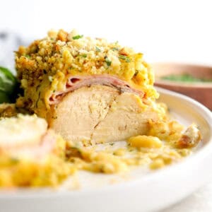 Crockpot chicken cordon bleu cut in half with stuffing topping.