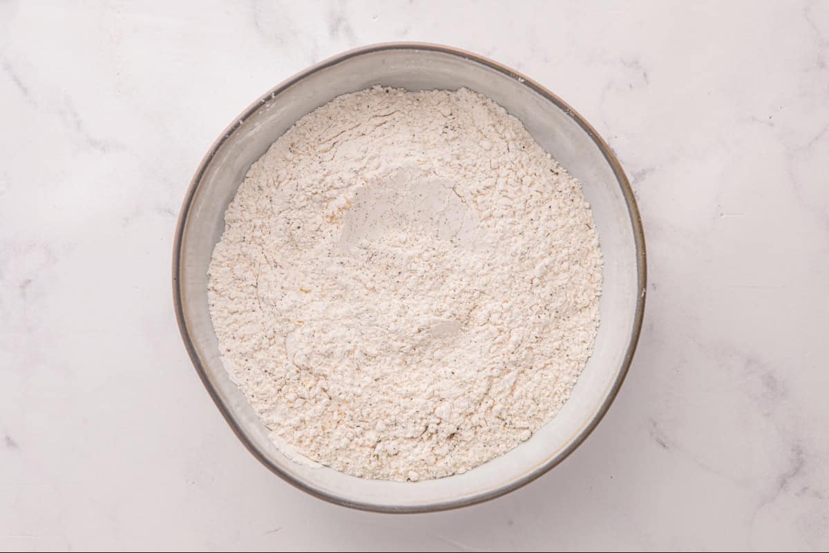 Seasoned flour in a shallow dish.