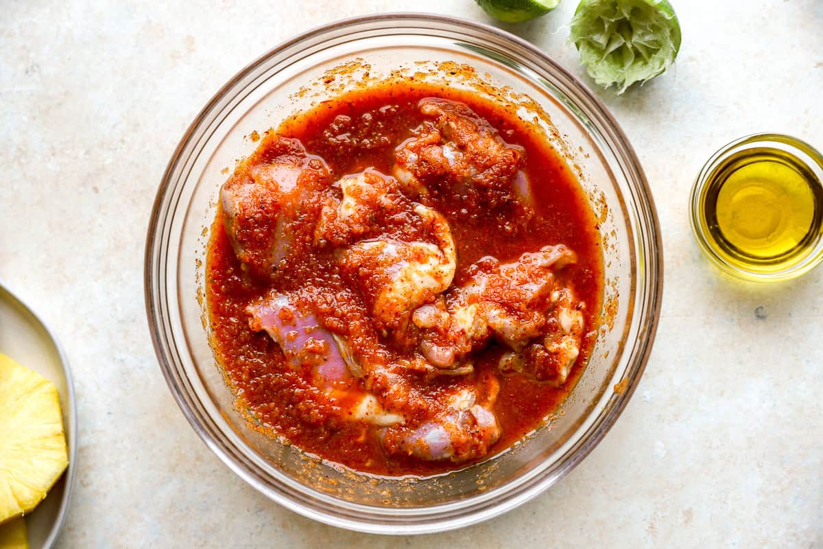 Chicken thighs marinating in chipotle mixture.