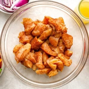 Chicken pieces tossed in seasoning.