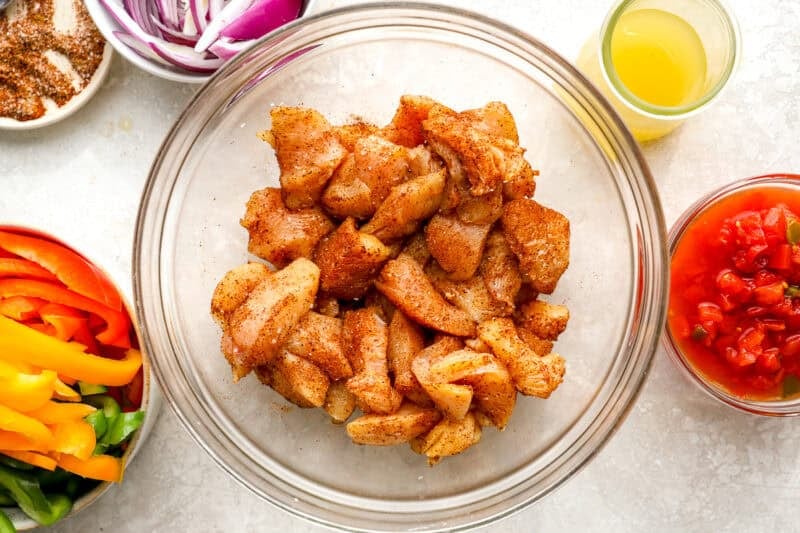 Chicken pieces tossed in seasoning.