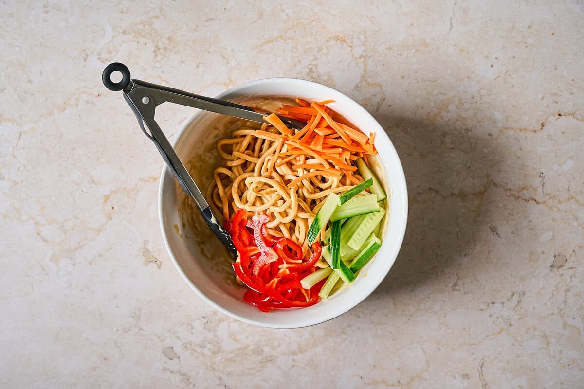 Noodle salad tossed with veggies.