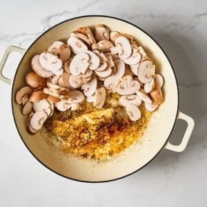 Mushrooms added to a pan.