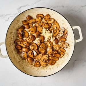 Browned mushrooms in a skillet.