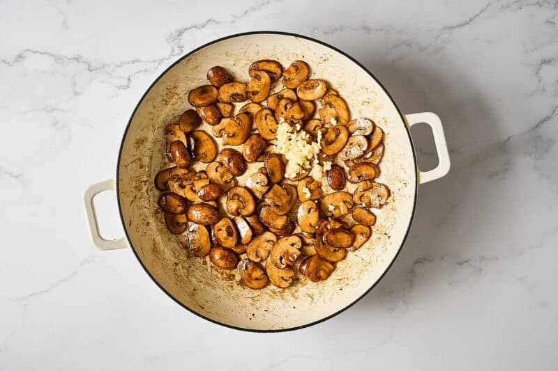 Browned mushrooms in a skillet.