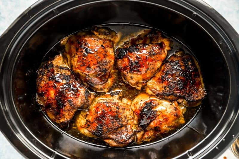 Sauce poured over the chicken thighs.