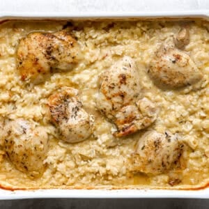 Baked chicken thighs in creamy rice casserole.