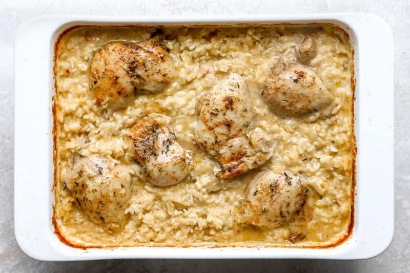 Baked chicken thighs in creamy rice casserole.