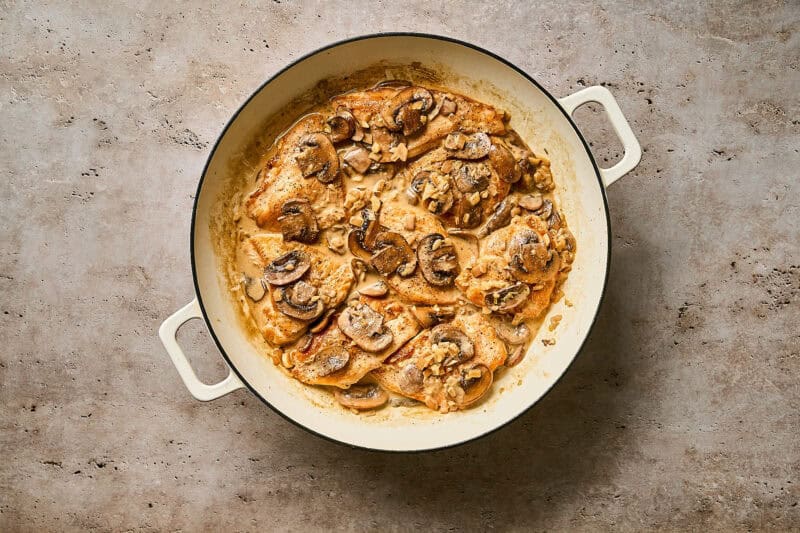 Chicken Diane in a skillet ready to eat.