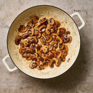 Browned mushrooms in a skillet.