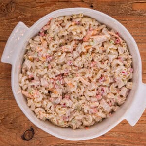 Chicken macaroni salad in a large white bowl.
