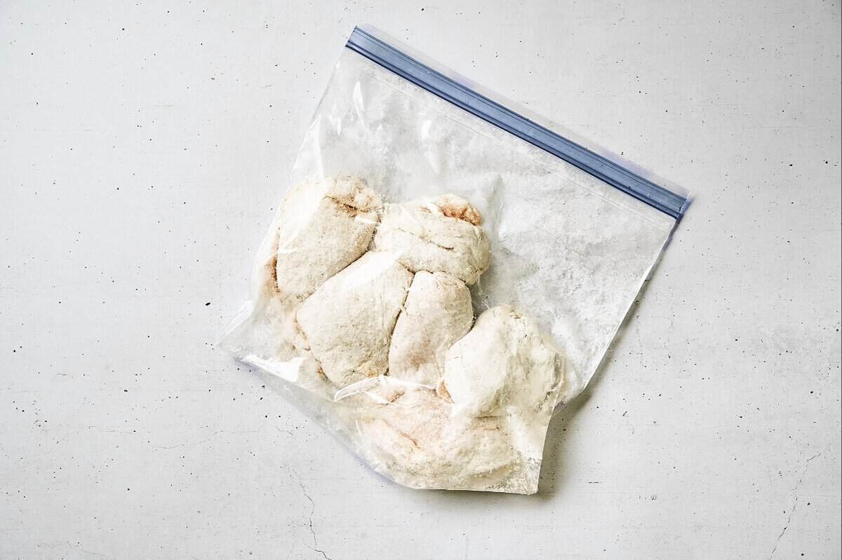 Chicken thighs in a zip lock bag with cornstarch.