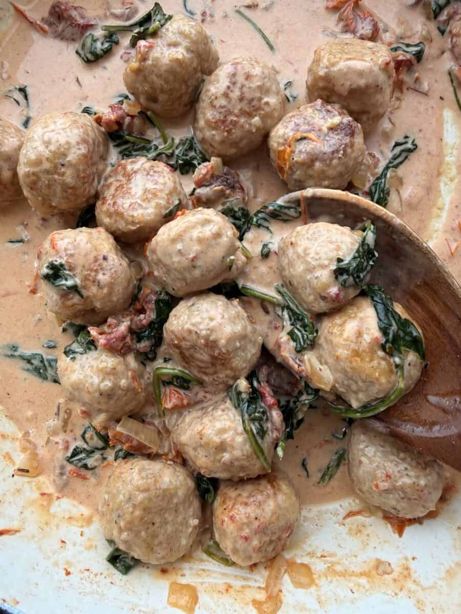 Chicken meatballs coated in creamy Tuscan sauce.