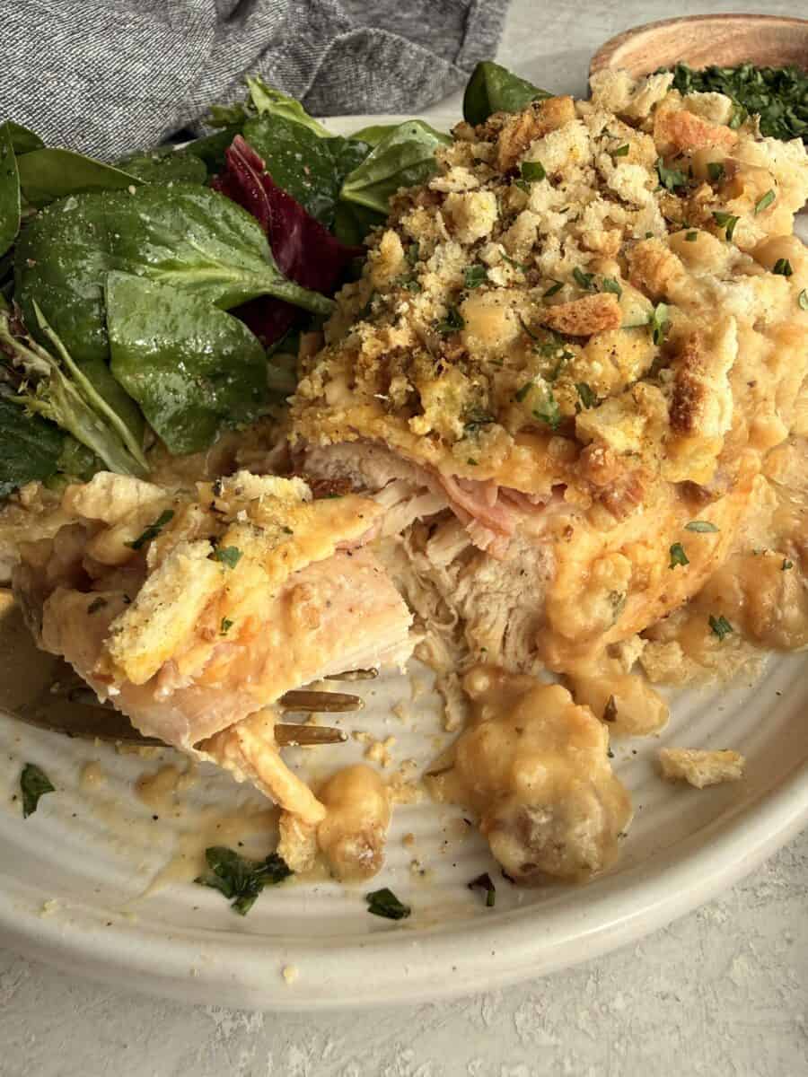 Partially sliced and eaten chicken cordon bleu.