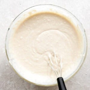 Biscuit batter in a glass mixing bowl.