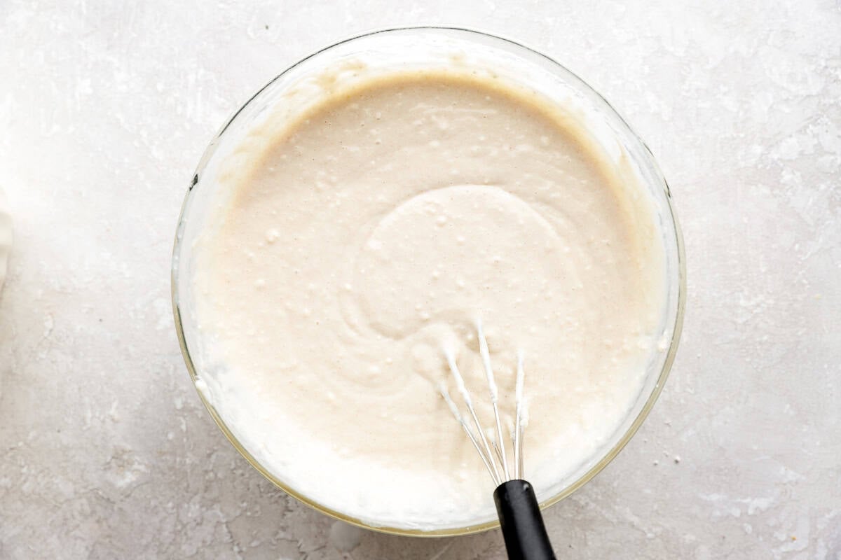 Biscuit batter in a glass mixing bowl.