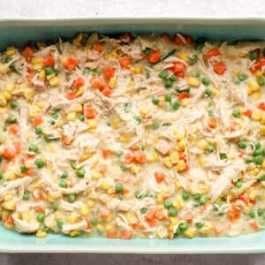 Chicken pot pie filling in a casserole dish.